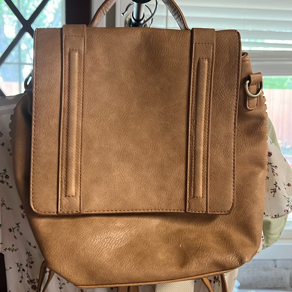 Vegan leather women bag pack in color Tan. In great condition used just ones